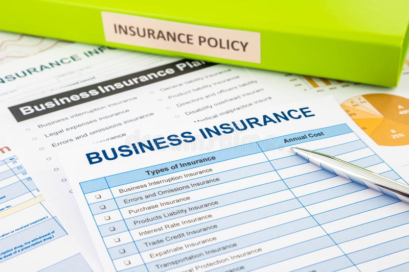 a table that full of business insurance documents
