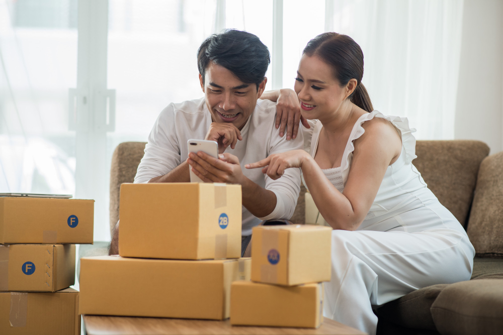 A couple shopping online through their smartphone