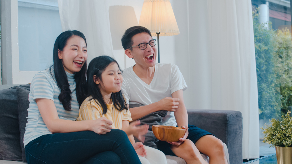 A family watching TV together