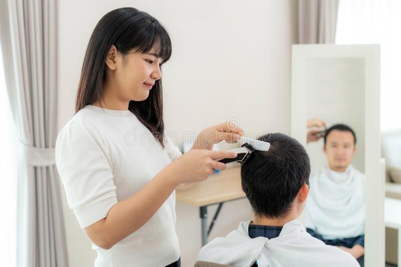 the hairdresser is taking care of her customer