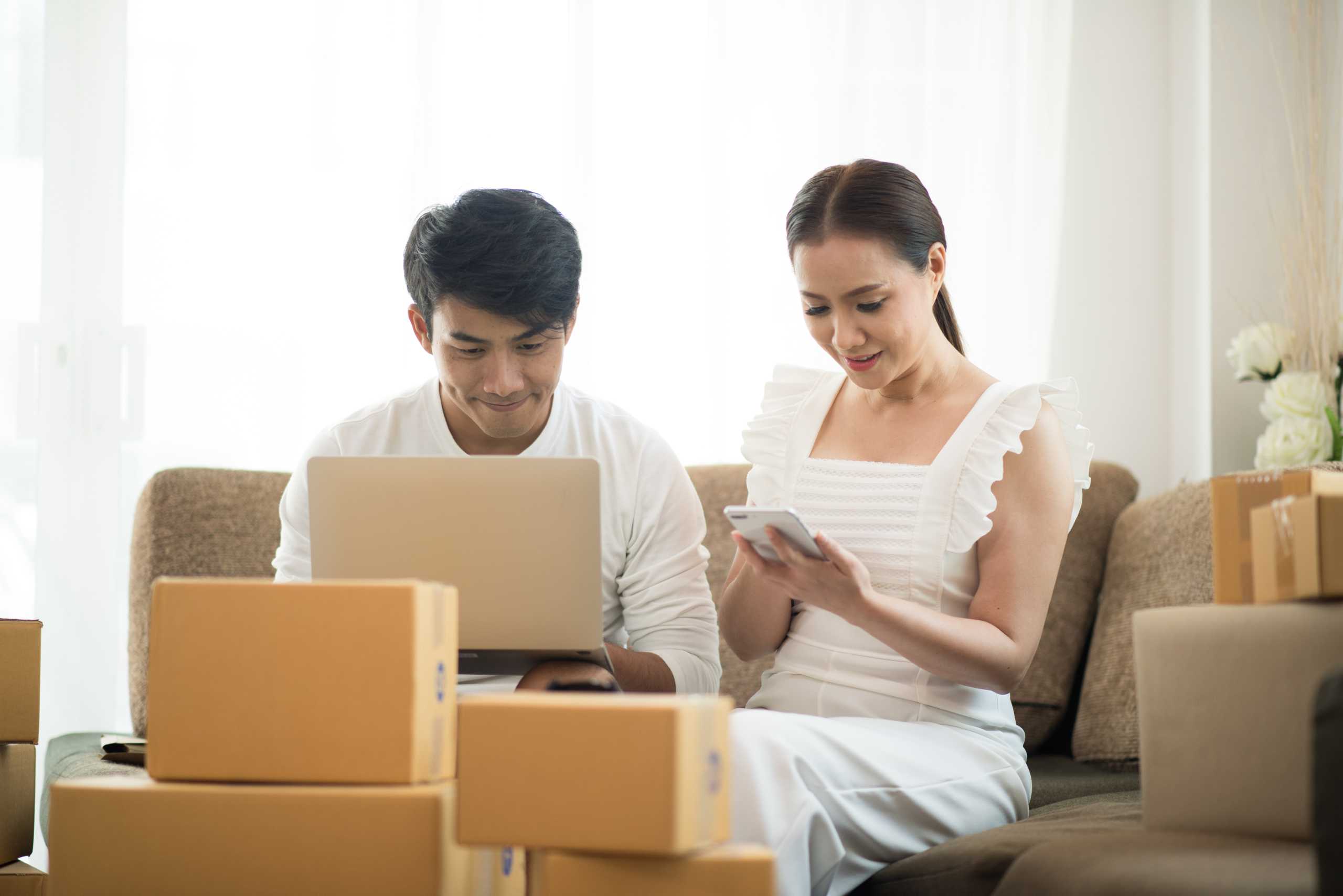 A couple conducting an online business together