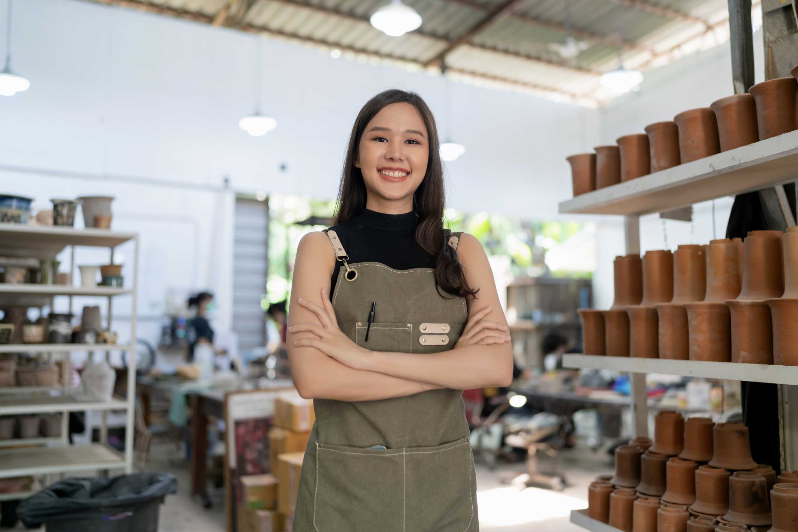 An entrepreneur with her pottery business