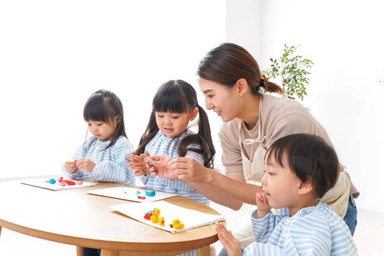 a woman being a child care of three children