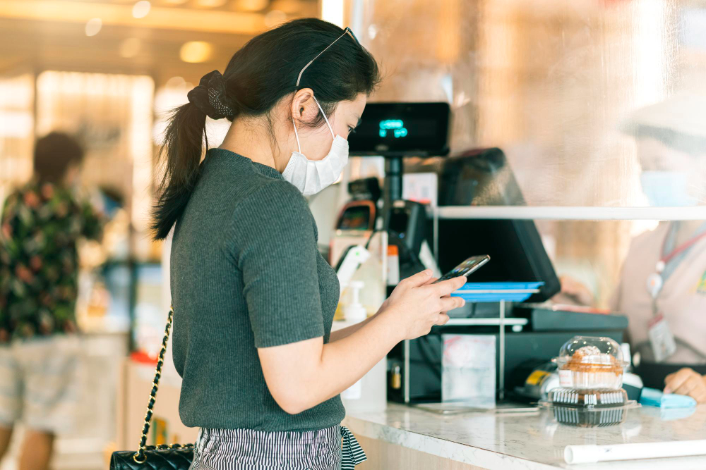 Woman paying for her groceries 