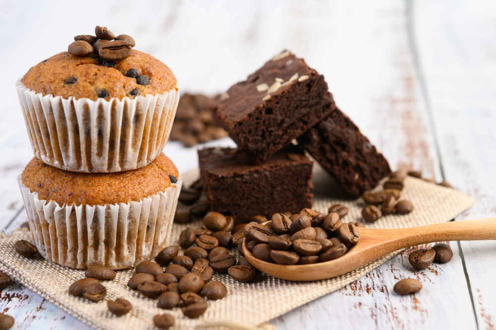 Cocoa beans, chocolate brownies and muffins