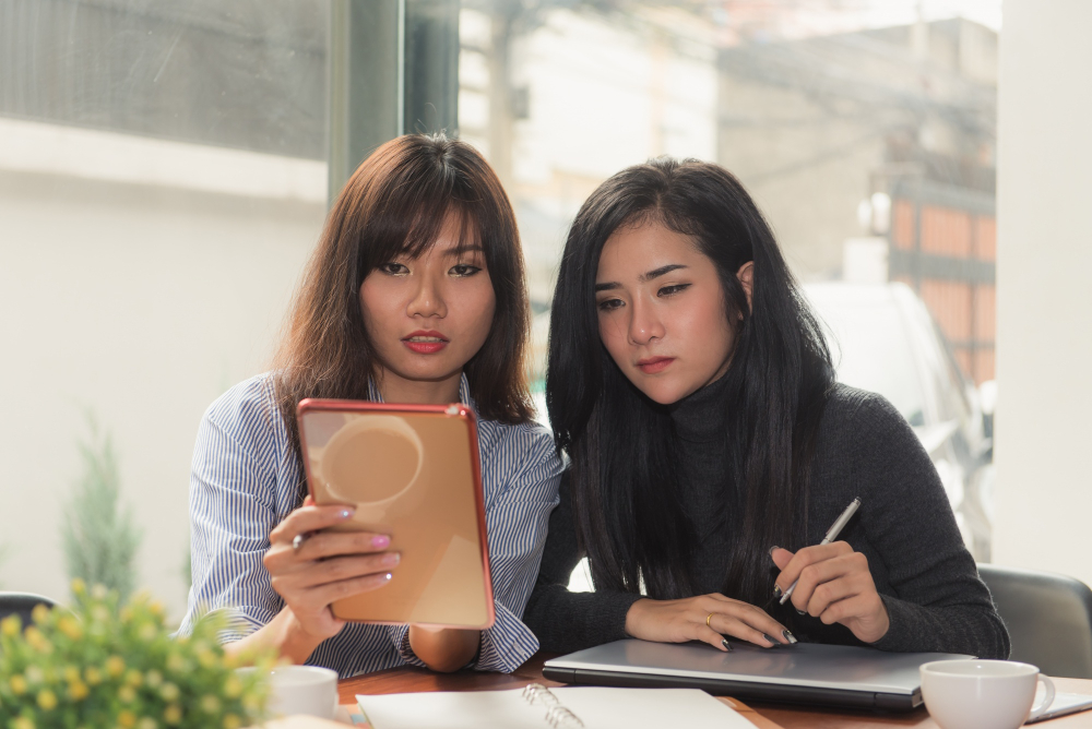 Two women sharing a tablet