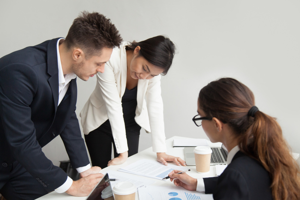 Three people having a meeting