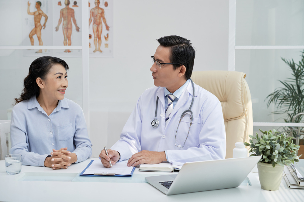 An elderly patient meeting her doctor