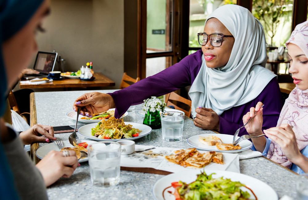 A group of women eating at a restaurant